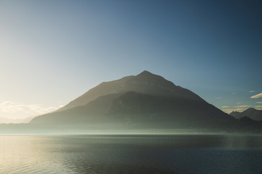 Mountain silhouette agains blue sky