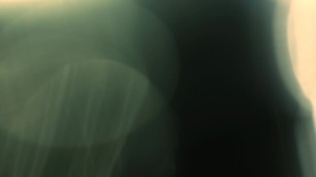 Slow motion real lens flare through glass effects for overlay or transition