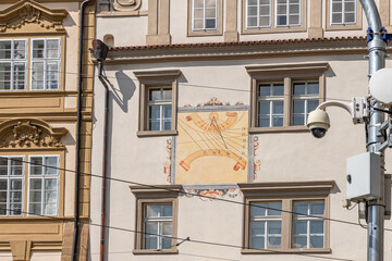 Obraz premium Sundial on the wall of an old building in historical part of the Prague in the Czech Republic