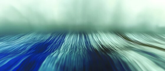  A crisp image of a wave in the ocean with a distinct blue and white horizontal stripe at its base