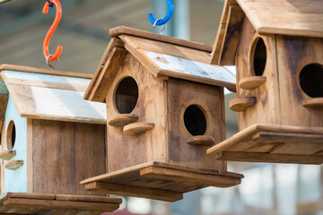 Wooden Birdhouses with Cozy Design, Hanging in a Garden Setting