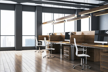 Modern office interior with desks and computers by large windows. 3D Rendering