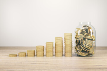 Savings and investing concept with growing up row of golden coin stacks and glass jar filled with gold coins on wooden table at light backdrop. 3D rendering