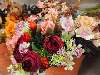 Beautiful Assorted Artificial Flowers in Vibrant Colors Arranged in a Floral Display