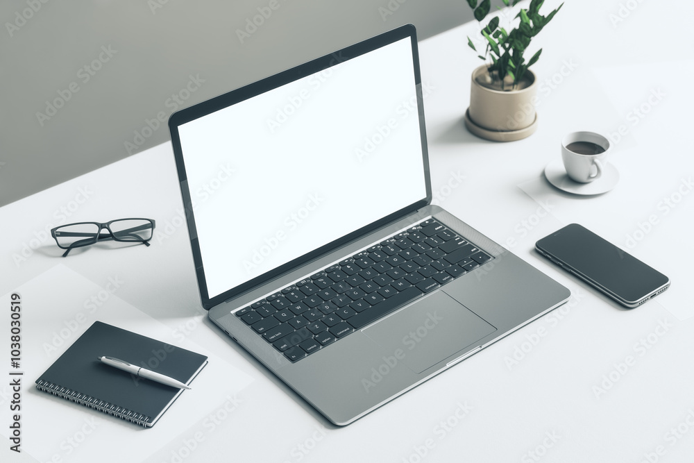 Poster Top side view on blank white modern laptop screen with copyspace for your logo or text on white table with glasses, notebook, smartphone and flowerpot on grey background. 3D rendering, mock up
