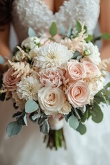 Delicate pink roses and white flowers arranged in a beautiful bouquet for a special occasion