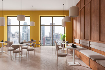 Modern cafe interior with city view and yellow walls. 3D Rendering