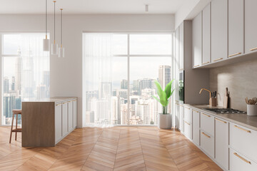 Light home kitchen interior with bar island and cabinet, panoramic window