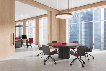 Modern office interior with a round meeting table and ergonomic chairs. 3D Rendering