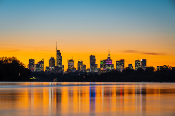 Warsaw, Poland - panorama of a city skyline at sunset. Cityscape view of Warsaw. Skyscrapers in Warsaw. Sunset over the river	