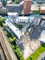 Aerial View of Greater Manchester City Centre and Tall Buildings During Golden Hour of Sunset. England UK. May 5th, 2024, High Angle Footage Was Captured with Drone's Camera