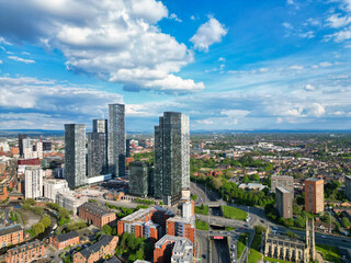 Fototapeta premium Aerial View of Greater Manchester City Centre and Tall Buildings During Golden Hour of Sunset. England UK. May 5th, 2024, High Angle Footage Was Captured with Drone's Camera