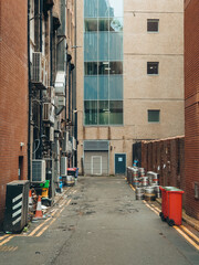 An access road with beer kegs stacked on one side