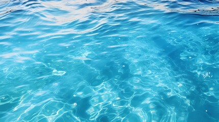 Obraz premium Crystal clear blue water reflecting sunlight beautifully.