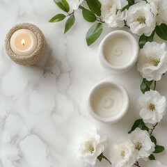 serene arrangement featuring two white candles surrounded by delicate white flowers and green leaves on marble surface. soft lighting creates calming atmosphere, perfect for relaxation