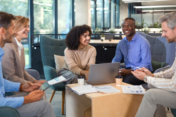 Group of happy progressive business people working on startup together at creative office