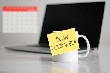 Plan your week is shown using the text on the cup. Time management concept