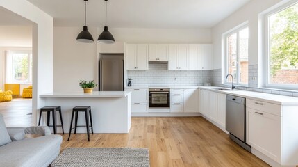 Fototapeta premium A modern, bright kitchen with white cabinetry, wooden flooring, stainless steel appliances, and large windows, creating a spacious and inviting atmosphere.