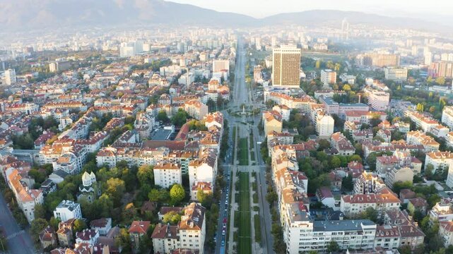 Establishing aerial footage of the city of Sofia Bulgaria with tram and a business center 