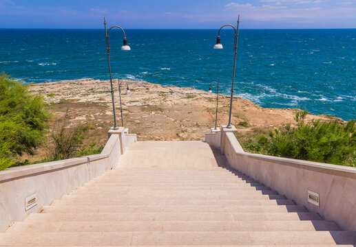Stairs at Polignano a mare in Puglia, Italy, Beach of Cala Paura in Puglia, Adriatic Sea., Lama Monachile beach, Polignano a Mare, Apulia, Italy, province of Bari.