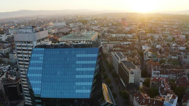 Establishing aerial footage of the city of Sofia Bulgaria with tram and a business center 