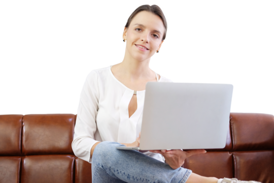 Caucasian young businesswoman sitting on sofa and holding laptop for working and online shopping in cafe