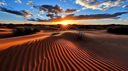 Naklejka premium Sunset over a Desert Landscape with Rippled Sand Dunes