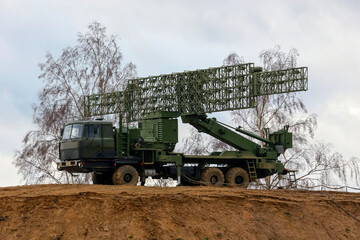 Fototapeta premium Military Radar Systems in a Cloudy Landscape