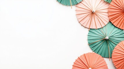 Obraz premium Colorful Party Decorations with Paper Umbrellas on White Background for Festive Celebrations and Events