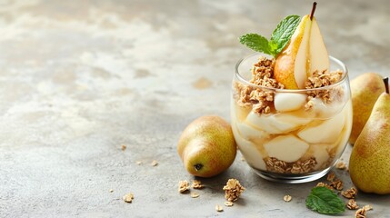 Pear and honey parfait, isolated on a light stone background with granola and fresh mint leaves as decoration