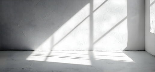 Obraz premium Sunlight Streaming Through Window Onto White Wall and Floor.
