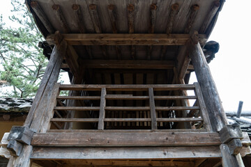 low-angle view of the balcony in the wooden building