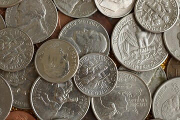 Pile with big amount of silver american cent coins as United States currency