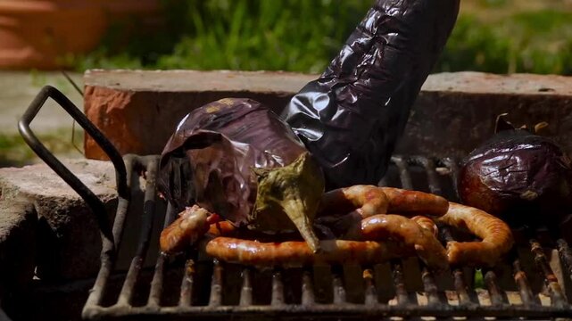 A rustic outdoor scene of vegetables grilling over a wood fire, an essential step in making traditional Romanian zacusca. The fire-roasted vegetables bring out deep, smoky flavors.