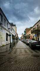 Urban street in Batumi with brick buildings, rainy day, Georgia
