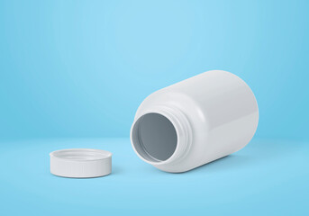 Blank plastic pill bottle on a light blue background