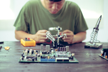 Technicians meticulously repair electronic components to turn them into precious gold. This process...