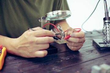 Technicians meticulously repair electronic components to turn them into precious gold. This process...