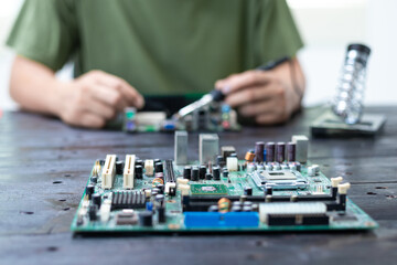 Technicians meticulously repair electronic components to turn them into precious gold. This process...