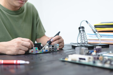 Technicians meticulously repair electronic components to turn them into precious gold. This process...