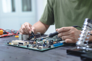 Technicians meticulously repair electronic components to turn them into precious gold. This process...