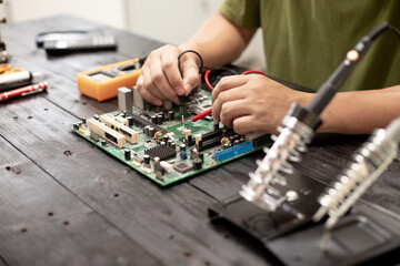 Technicians meticulously repair electronic components to turn them into precious gold. This process...