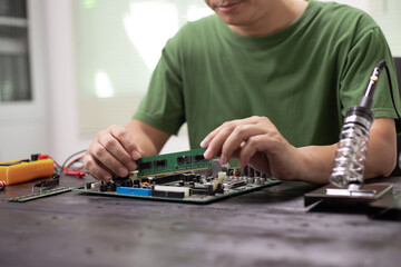 Technicians meticulously repair electronic components to turn them into precious gold. This process...