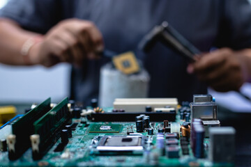Technicians meticulously repair electronic components to turn them into precious gold. This process...