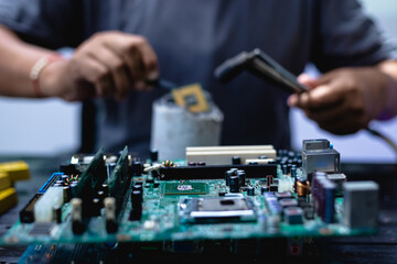 Technicians meticulously repair electronic components to turn them into precious gold. This process...