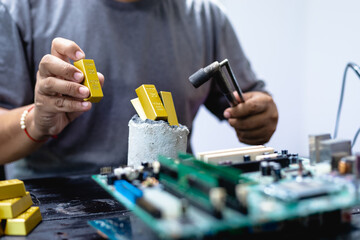 Technicians meticulously repair electronic components to turn them into precious gold. This process...