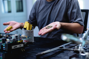 Technicians meticulously repair electronic components to turn them into precious gold. This process...