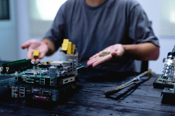 Technicians meticulously repair electronic components to turn them into precious gold. This process...
