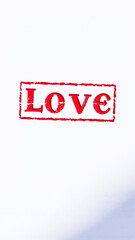red stamp the word 'love' on a white background