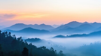 Fototapeta premium A serene view of mountains covered in mist, with soft light breaking through at sunrise, symbolizing the tranquility of untouched nature